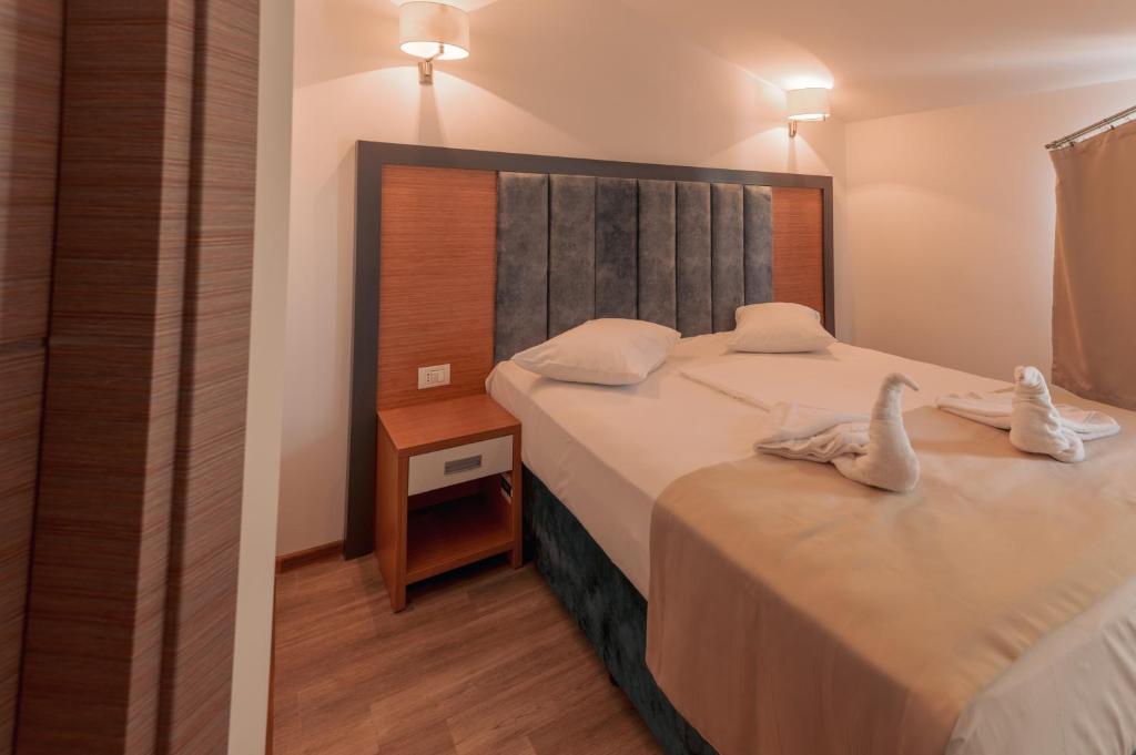 Postel nebo postele na pokoji v ubytování Lara Boutique