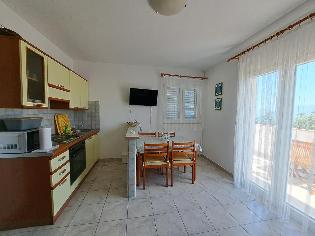 Kuchyň nebo kuchyňský kout v ubytování Apartments Galović