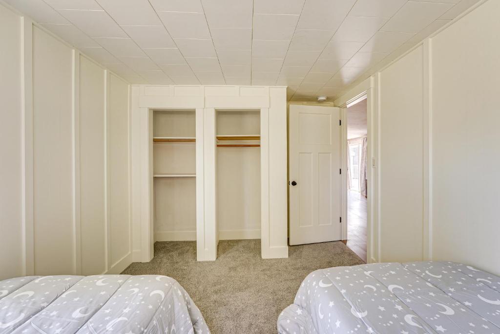 a bedroom with a bed and a closet at Less Than 3 Mi to Double JJ Resort Home with Large Yard! in Rothbury