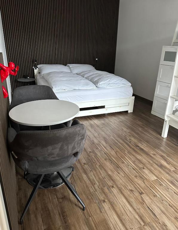 A bed or beds in a room at SKY one & two