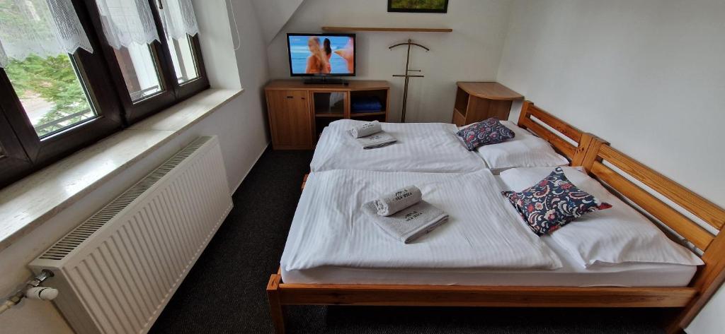 Letto o letti in una camera di Vila Jedľa