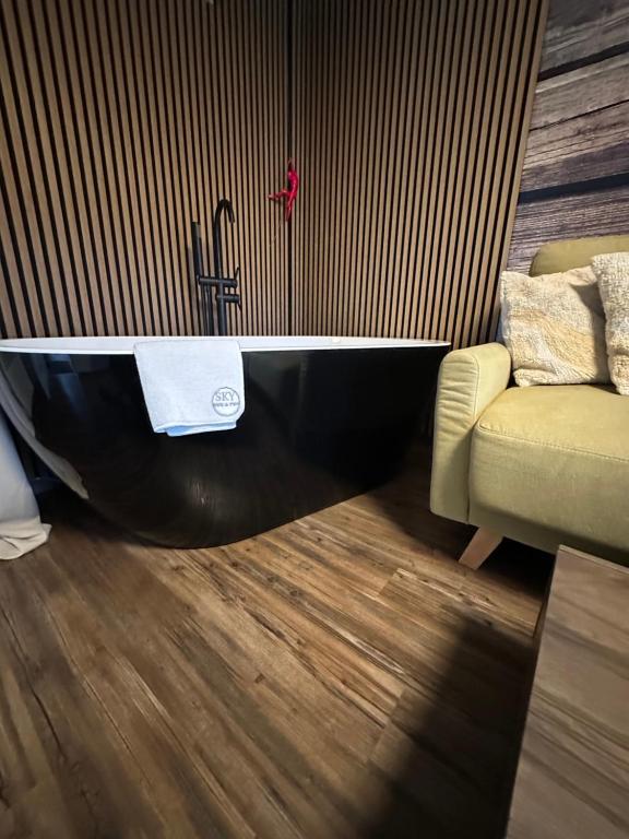 A bed or beds in a room at SKY one & two
