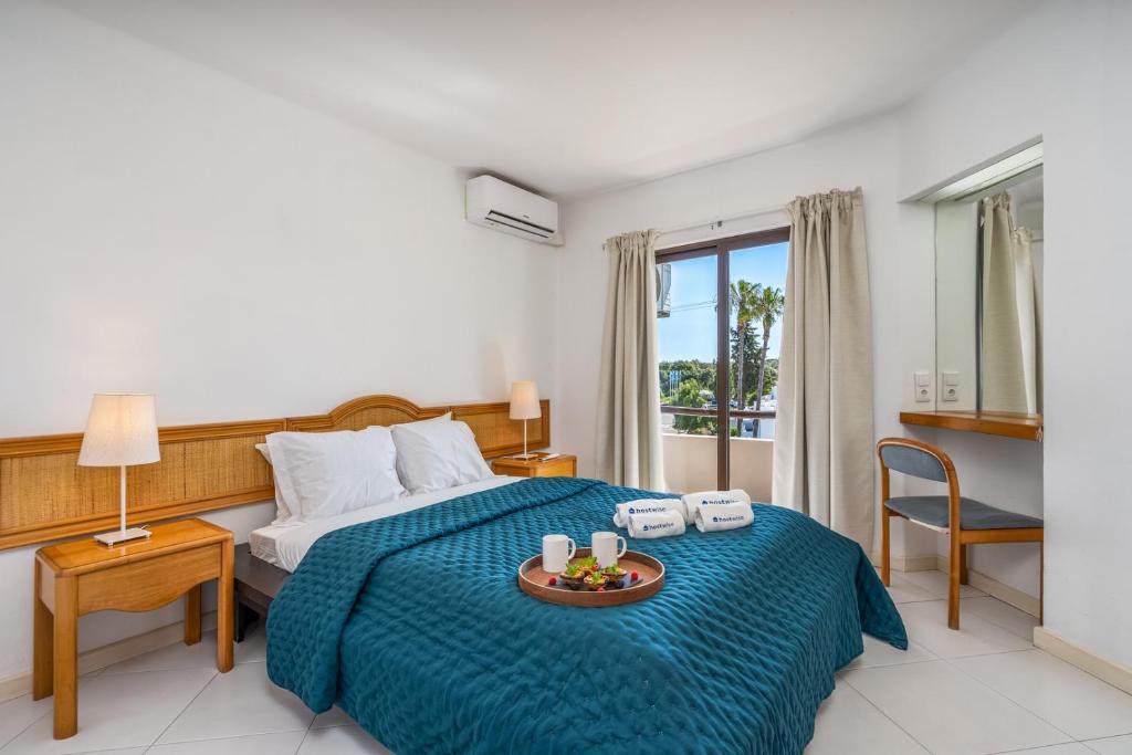Sunny Flat with a Balcony & Pool by HostWise