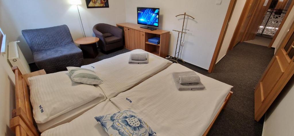 Letto o letti in una camera di Vila Jedľa