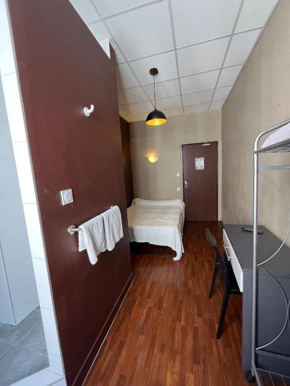 Postel nebo postele na pokoji v ubytování Hotel d Enghien