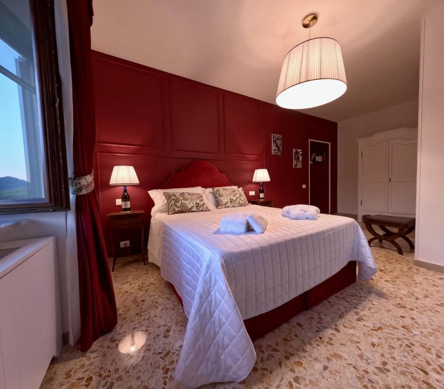 Postel nebo postele na pokoji v ubytování Reale Wine Resort