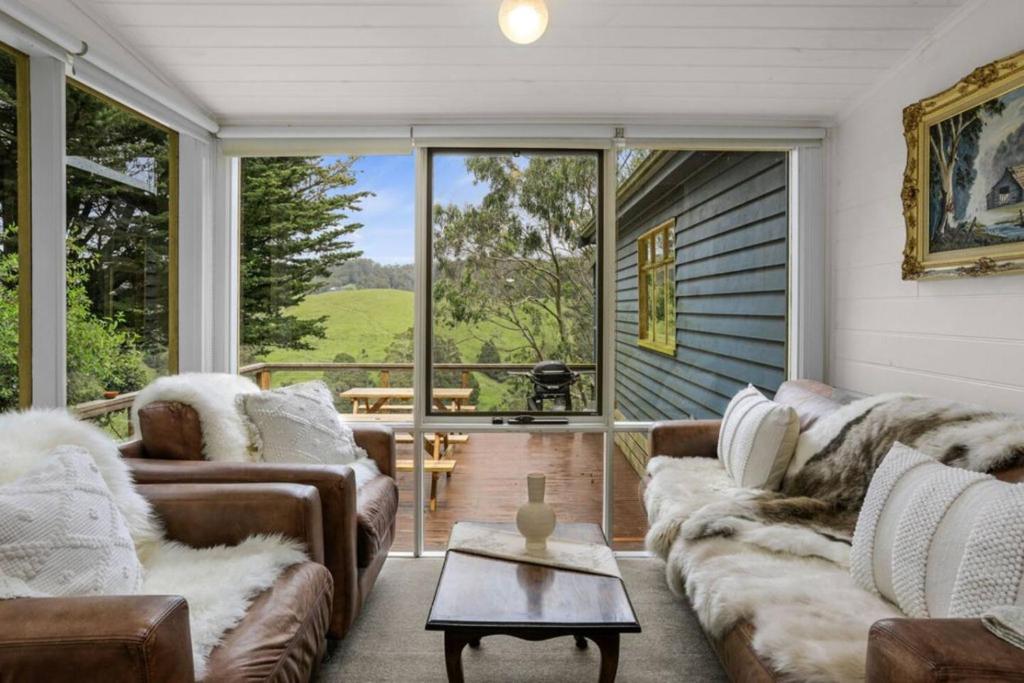 Χώρος καθιστικού στο Blue Farm Cottage