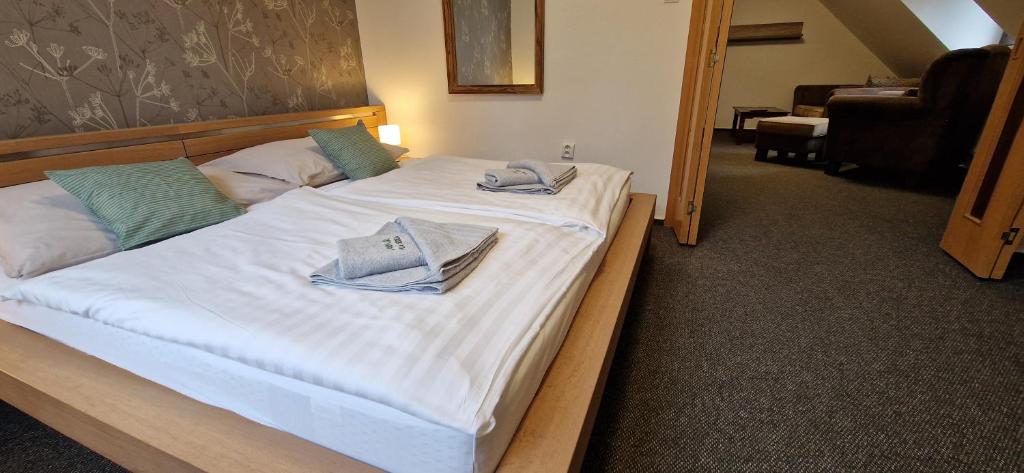 Letto o letti in una camera di Vila Jedľa