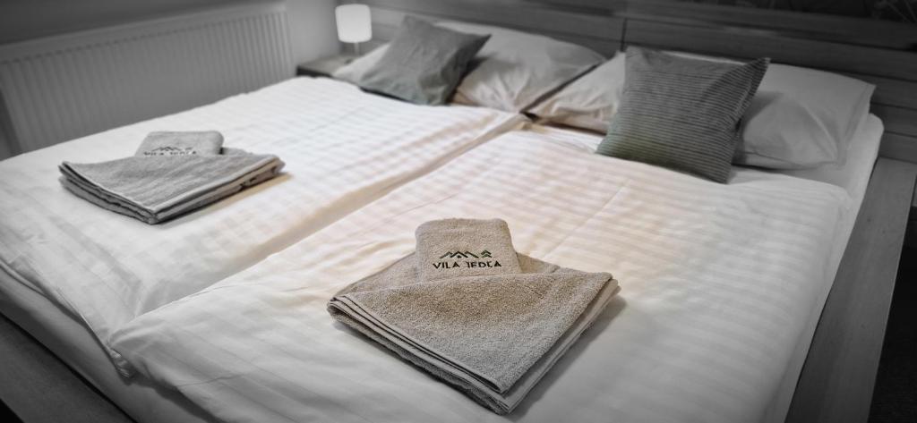 Letto o letti in una camera di Vila Jedľa