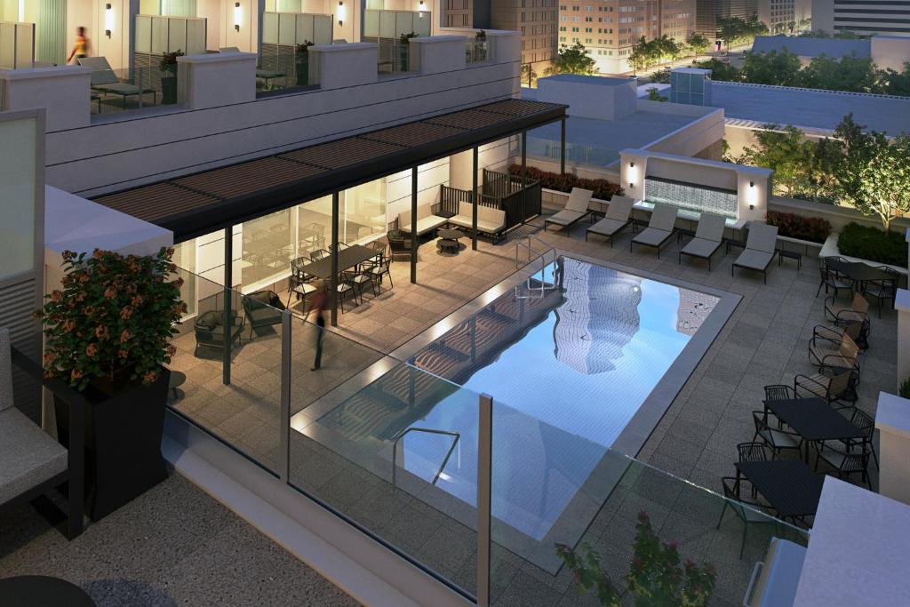 an aerial view of a building with a swimming pool at Holiday Inn Express Houston Downtown by IHG in Houston