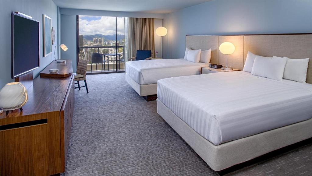 Postel nebo postele na pokoji v ubytování Hyatt Regency Waikiki Beach Resort & Spa