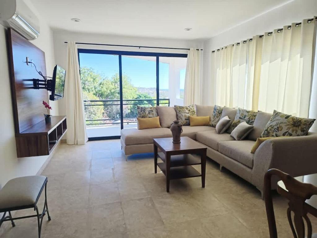 a living room with a couch and a table at Spacious and luxurious Yumil Condominium 137m2 in Los Barriles