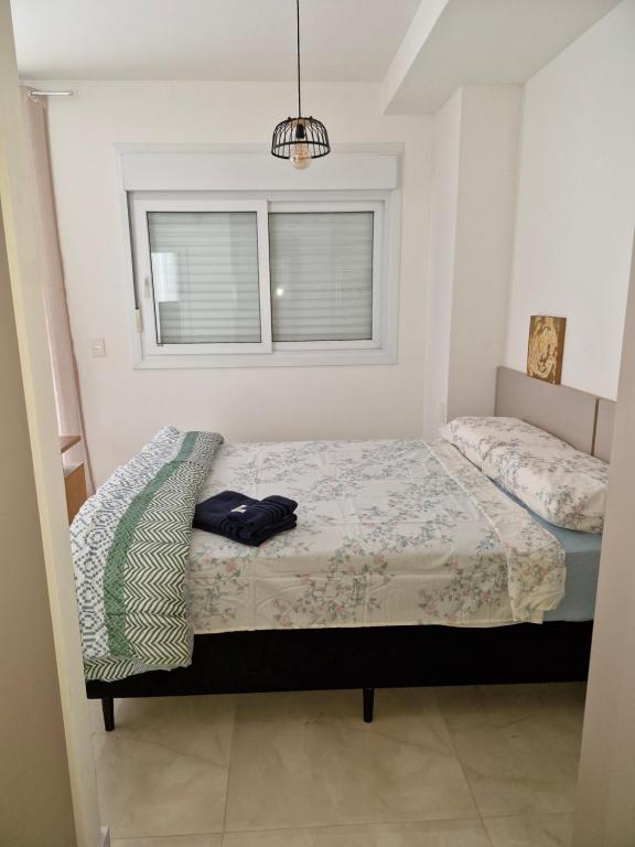 Postel nebo postele na pokoji v ubytování Loft confortável com garden