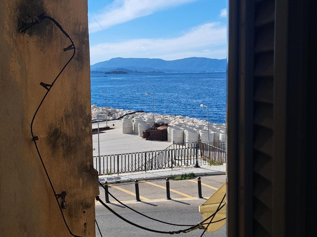 a view of the ocean from a window at Deppy's Two-storey House in Corfu