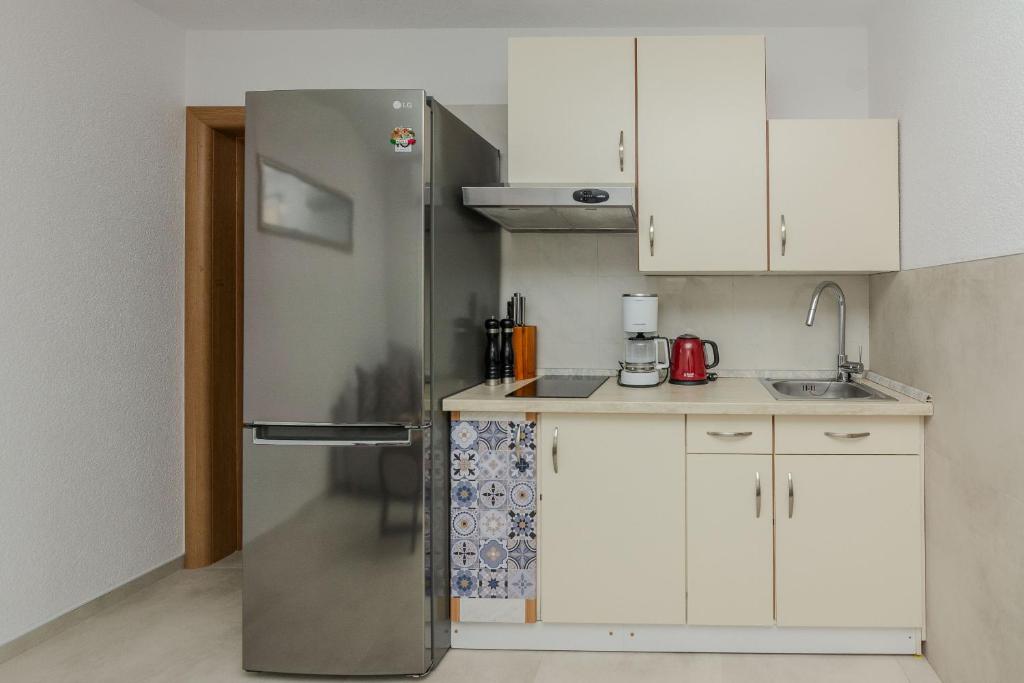 Kuchyňa alebo kuchynka v ubytovaní Apartments Tukara