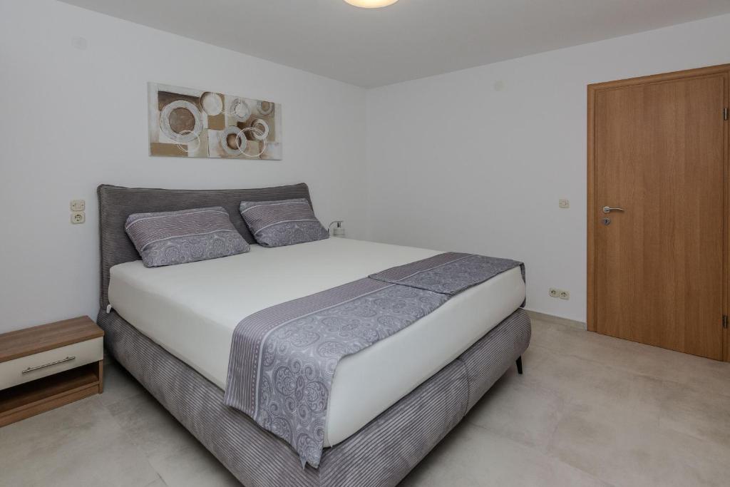 Posteľ alebo postele v izbe v ubytovaní Apartments Tukara