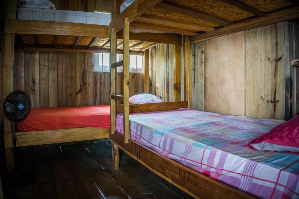 Postel nebo postele na pokoji v ubytování Hostal On The Sea