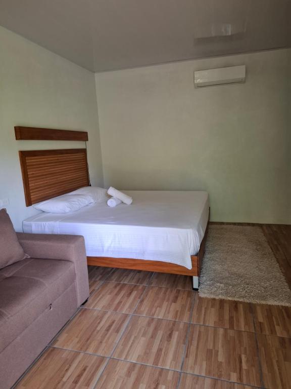 Postel nebo postele na pokoji v ubytování Bungalow Batsù