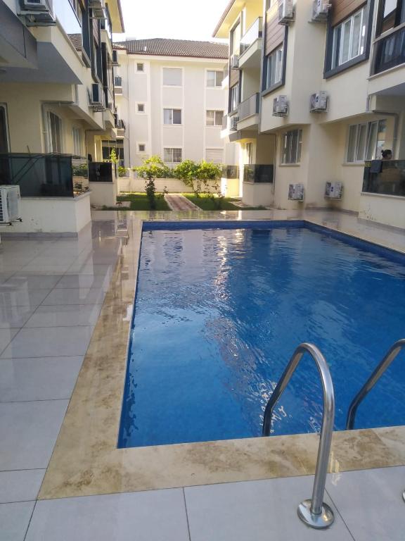a swimming pool in the middle of a building at Umut's Hause in Bezkesen