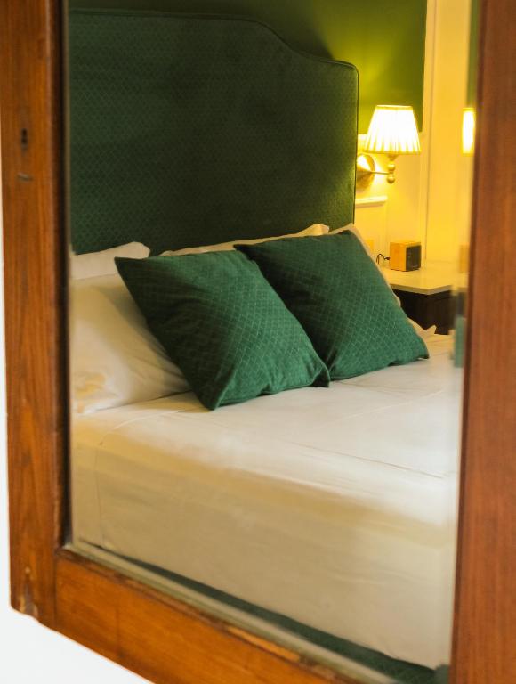 Postel nebo postele na pokoji v ubytování Putechella Retro Rooms & Villa