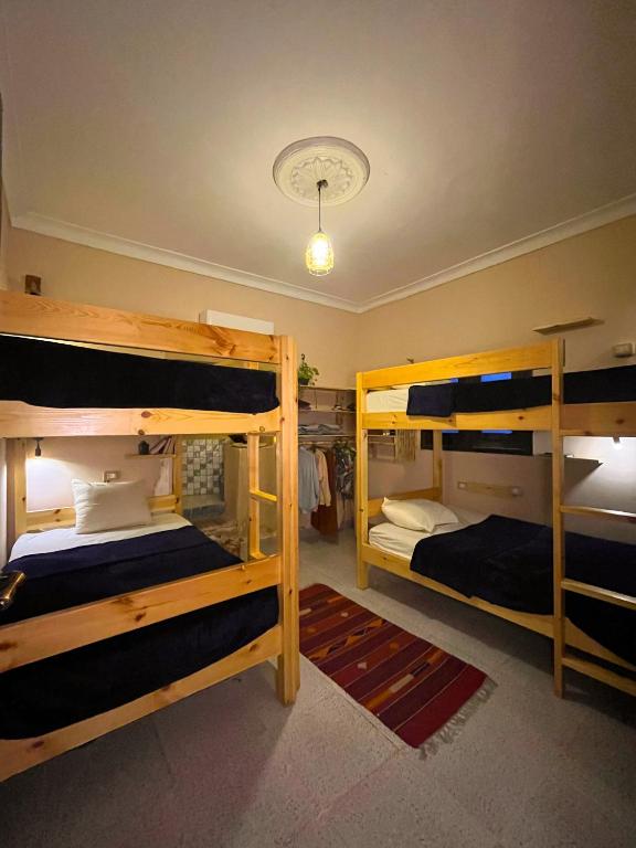 Postel nebo postele na pokoji v ubytování Tecoma Hostel