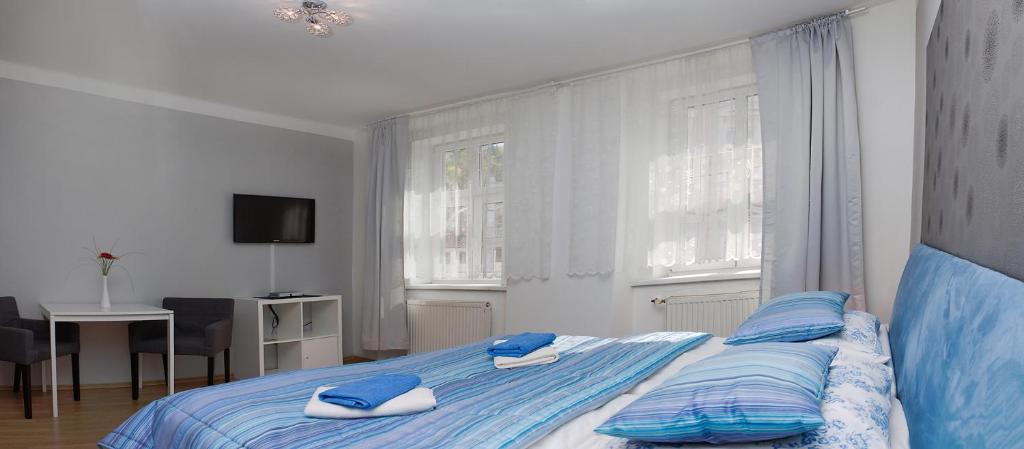 Postel nebo postele na pokoji v ubytování Hotel Richmond Teplice