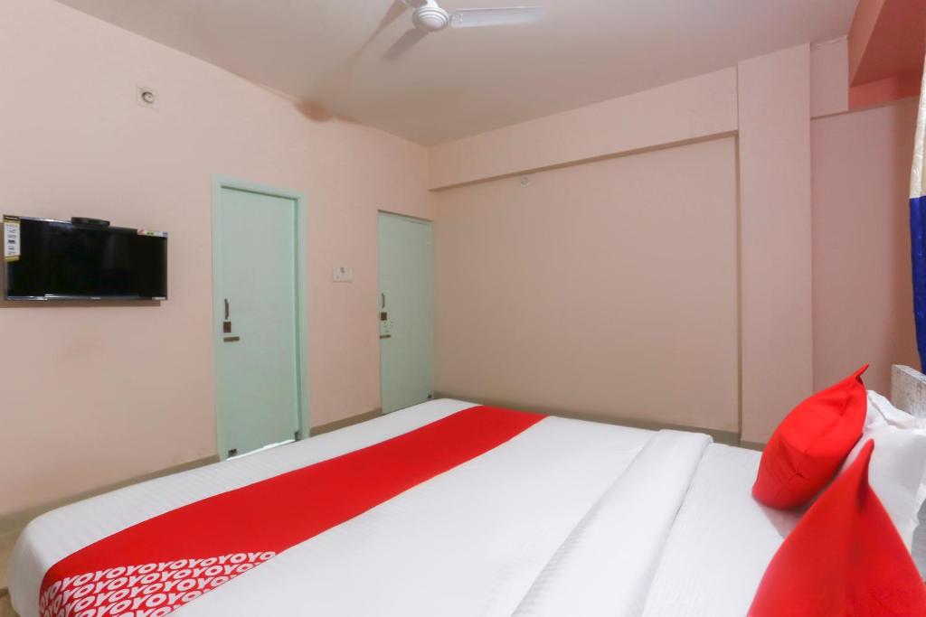 Postel nebo postele na pokoji v ubytování Hotel O Avigna Residency