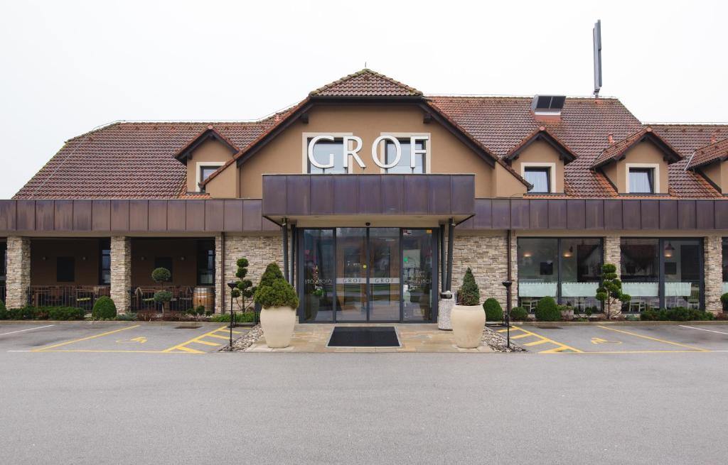 a building with a cct sign on the front of it at Guesthouse Grof in Vransko