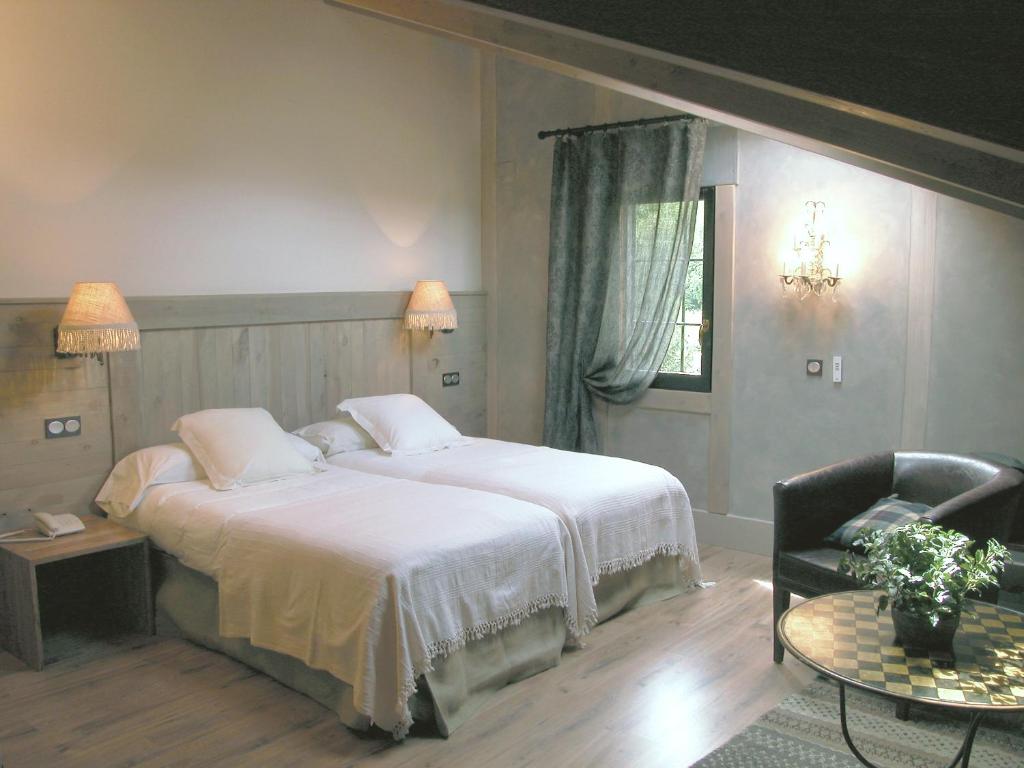 Postel nebo postele na pokoji v ubytování Hotel Plaza