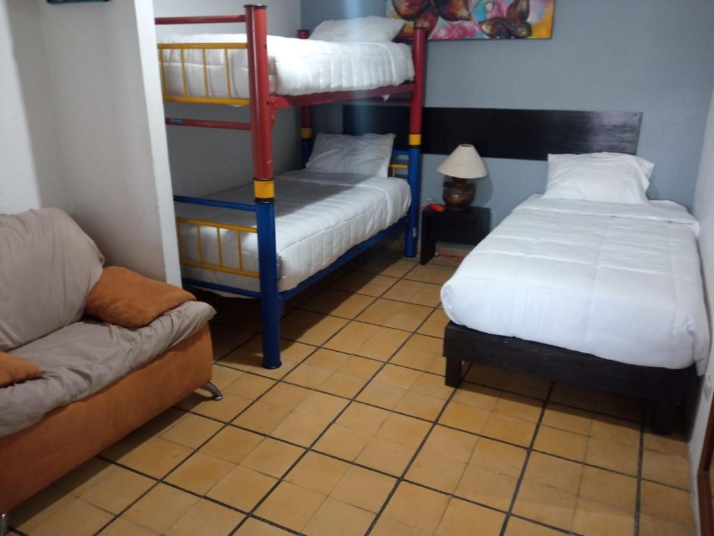 Postel nebo postele na pokoji v ubytování Hotel Gandag
