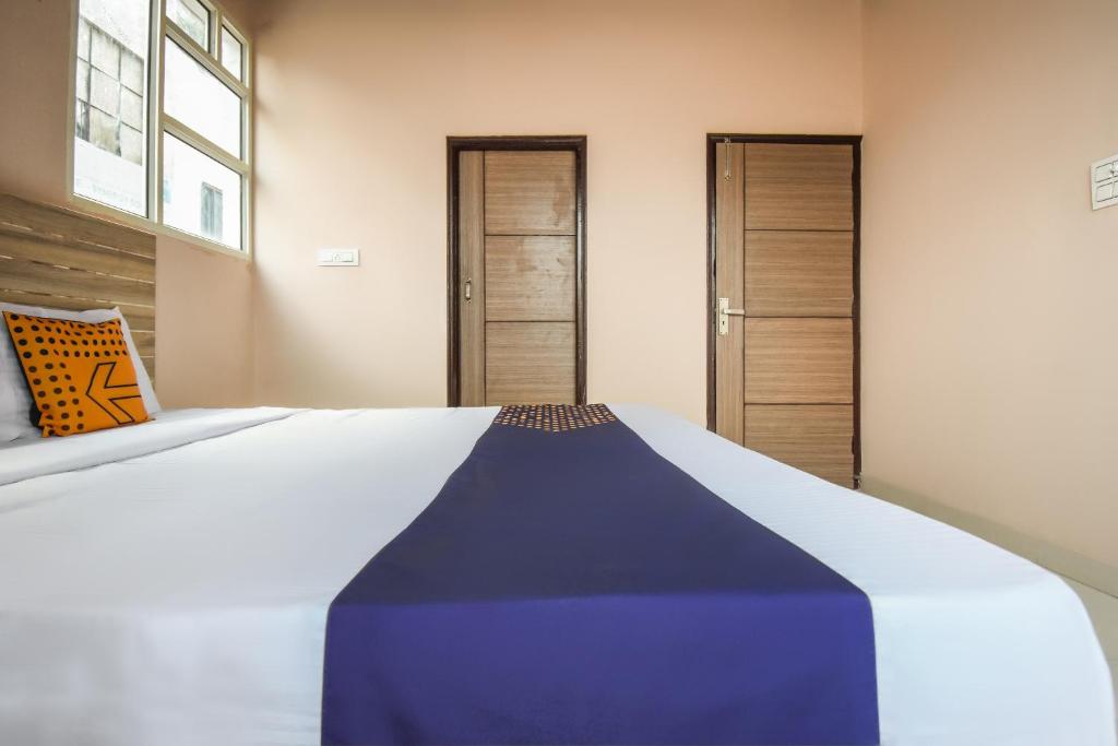 Postel nebo postele na pokoji v ubytování Hotel O Hi Tech