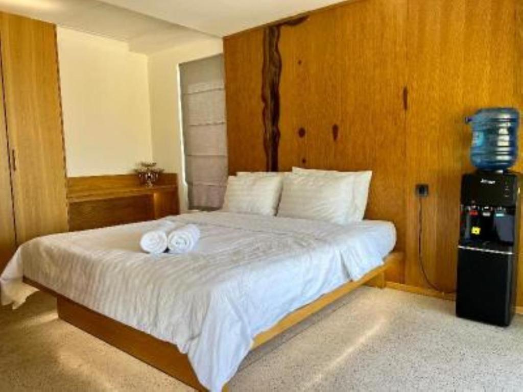 Postel nebo postele na pokoji v ubytování Đất Quảng Villa