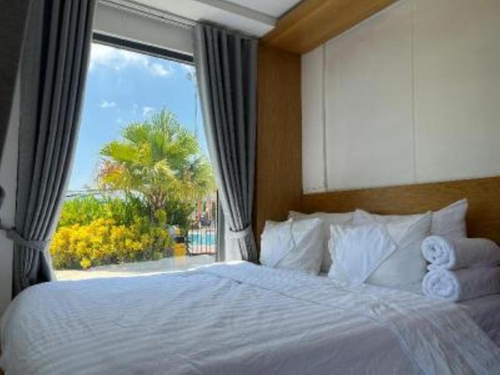 Postel nebo postele na pokoji v ubytování Đất Quảng Villa