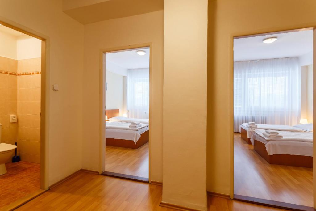 Postel nebo postele na pokoji v ubytování Hotel Veronika