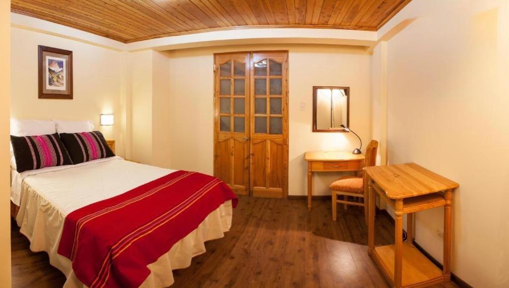 Postel nebo postele na pokoji v ubytování Maimara Hotel