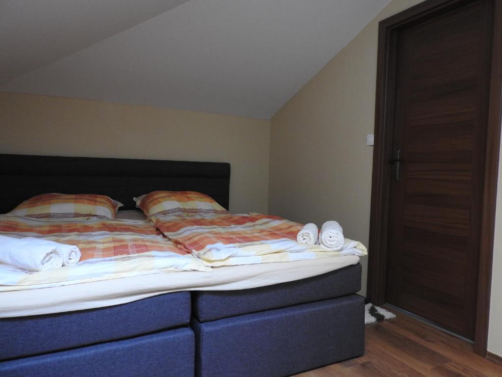 Postel nebo postele na pokoji v ubytování Fridrich apartman