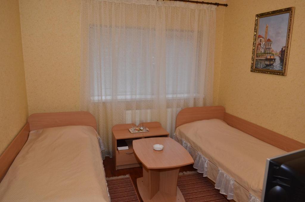 Postel nebo postele na pokoji v ubytování Hotel Serpanok