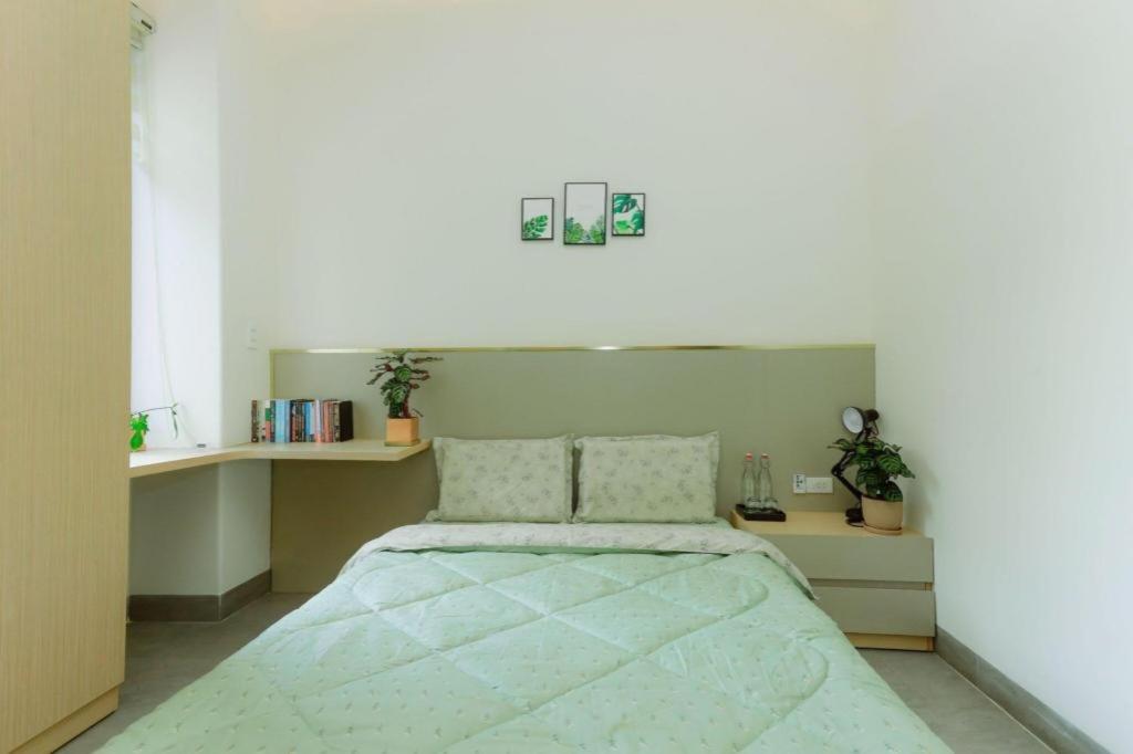 Postel nebo postele na pokoji v ubytování Nha Trong Pho - Moon House