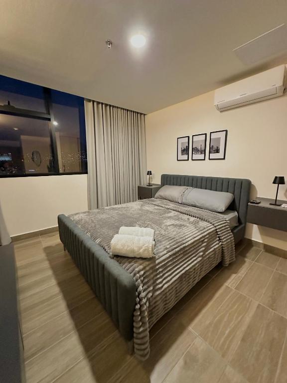 Postel nebo postele na pokoji v ubytování Cómodo y Lujoso Apartamento en Artemisa