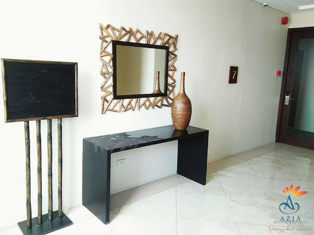 TV a/nebo společenská místnost v ubytování Azia Suites and Residences