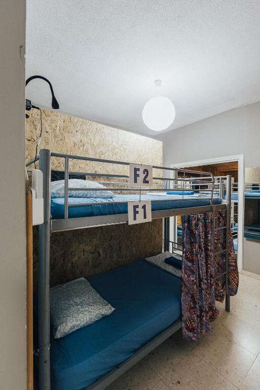 Postel nebo postele na pokoji v ubytování One Love One World Ayia Napa Square Hostel