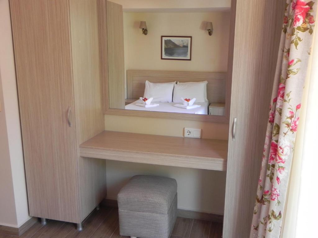 Postel nebo postele na pokoji v ubytování Sun Blue Apart Hotel
