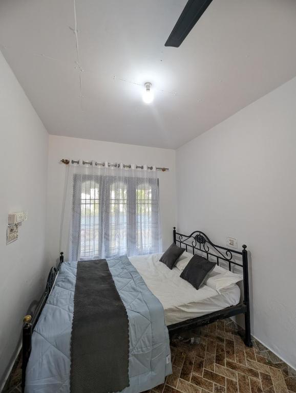 Ένα ή περισσότερα κρεβάτια σε δωμάτιο στο Elite Cottages