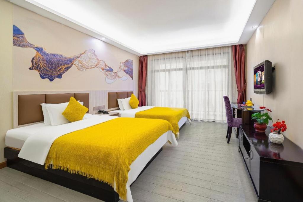 Postel nebo postele na pokoji v ubytování Oriental Hotel