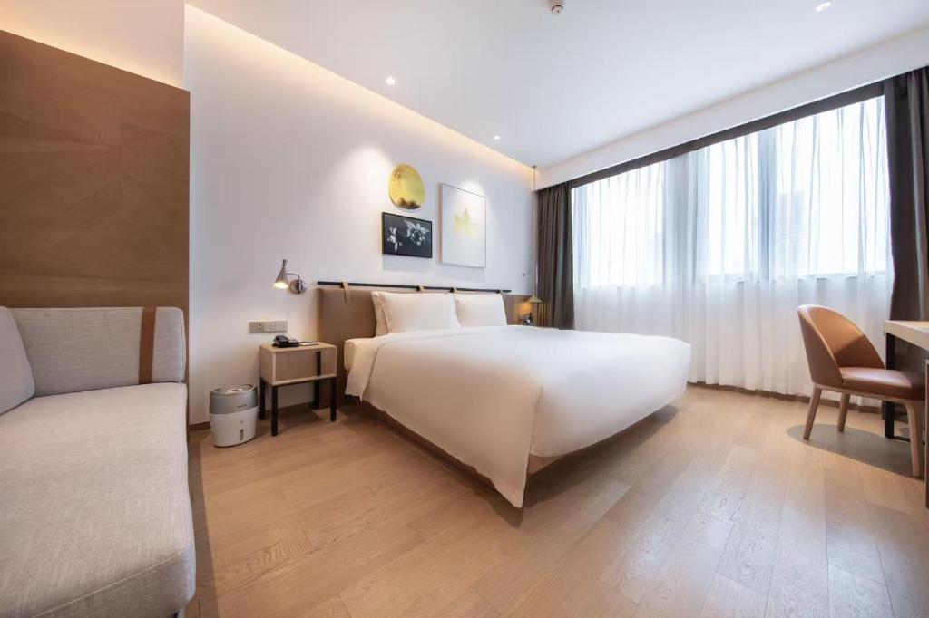 Postel nebo postele na pokoji v ubytování Atour Hotel Shenzhen Nanshan Vanke Yuncheng
