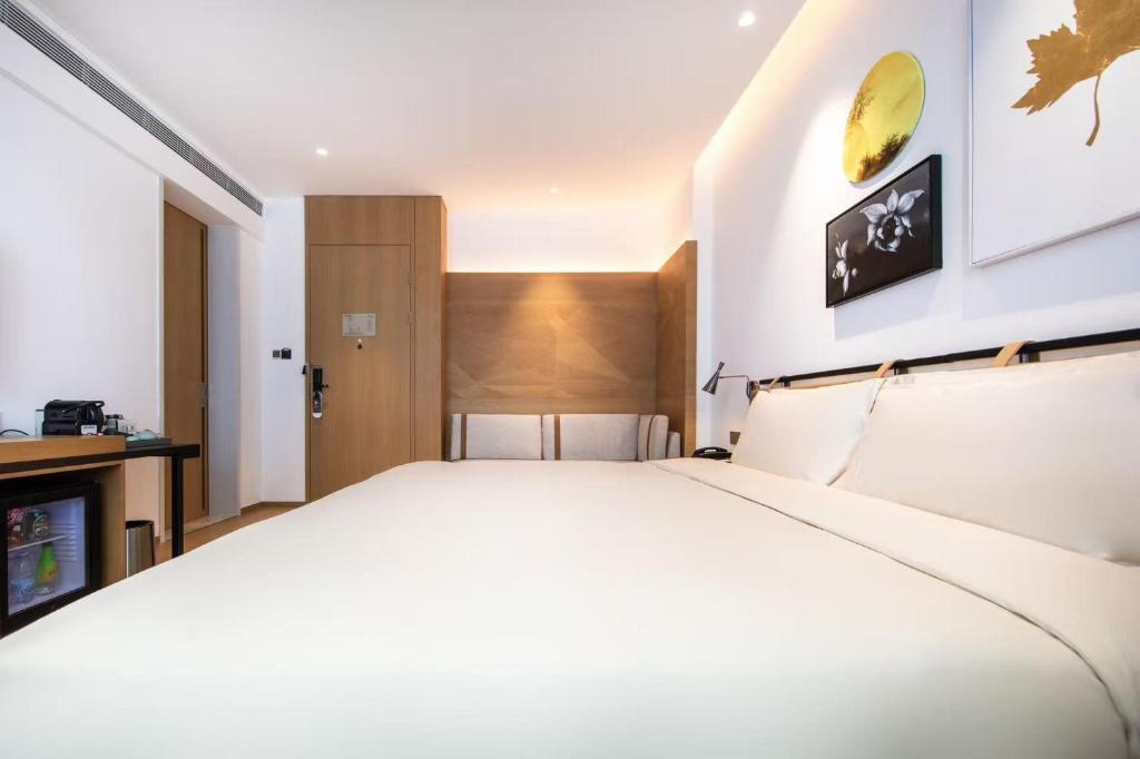 Postel nebo postele na pokoji v ubytování Atour Hotel Shenzhen Nanshan Vanke Yuncheng
