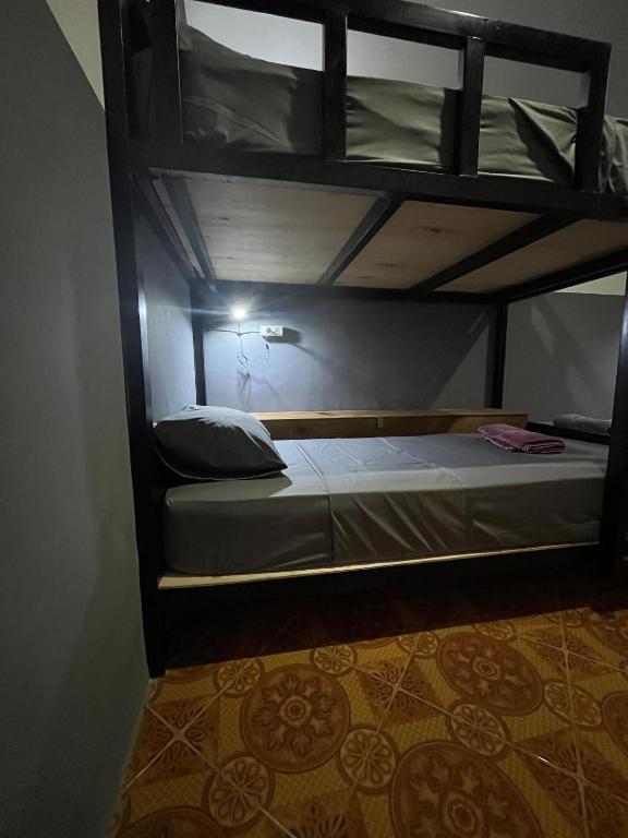 Postel nebo postele na pokoji v ubytování Bintang Guesthouse