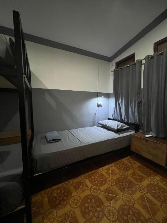 Postel nebo postele na pokoji v ubytování Bintang Guesthouse