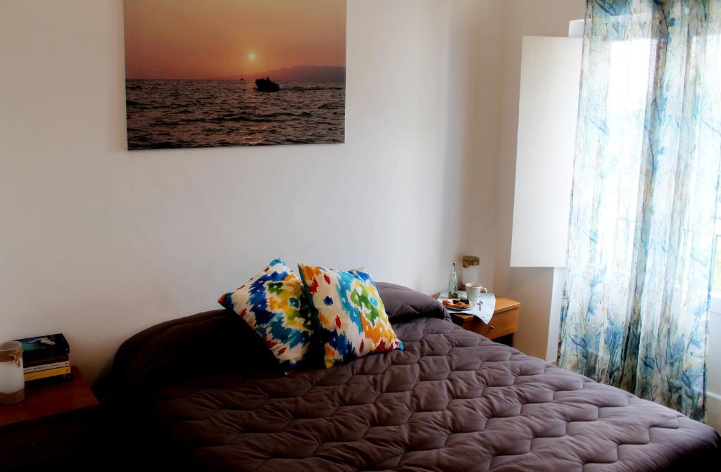 Postel nebo postele na pokoji v ubytování Il Vecchio e Il Mare Maratea