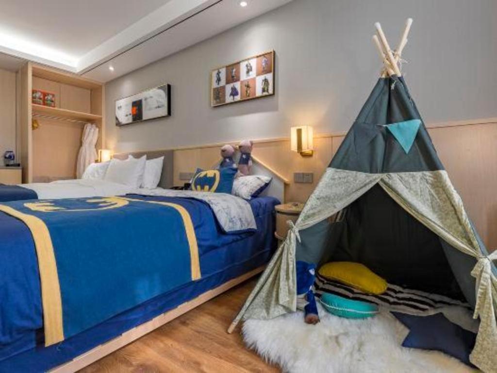 Ένα ή περισσότερα κρεβάτια σε δωμάτιο στο YUN-RAY Ambassador Hotel